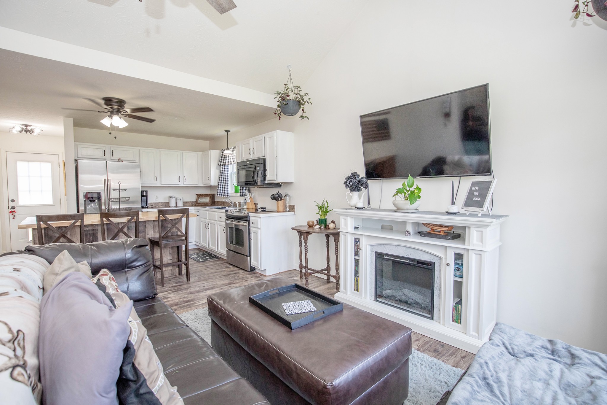 148 Filly Lane Springfield, TN 37172 - Photo 6 of 33 a living room with furniture a fireplace and a flat screen tv