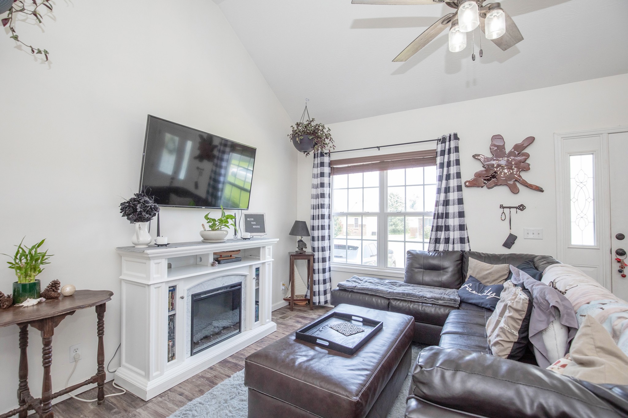 148 Filly Lane Springfield, TN 37172 - Photo 9 of 33 a living room with furniture a fireplace and a flat screen tv