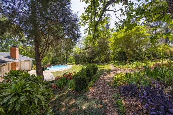 a backyard of a house with lots of green space