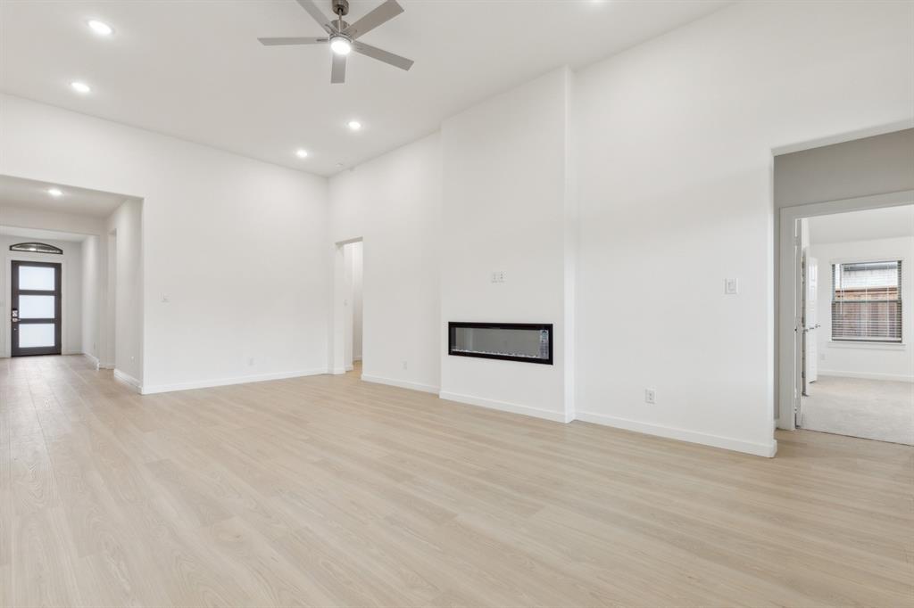 373 Yellowstar Lane Lavon, TX 75166 - Photo 10 of 32 Living Room in the Gilmour II home plan by Trophy Signature Homes – REPRESENTATIVE PHOTO