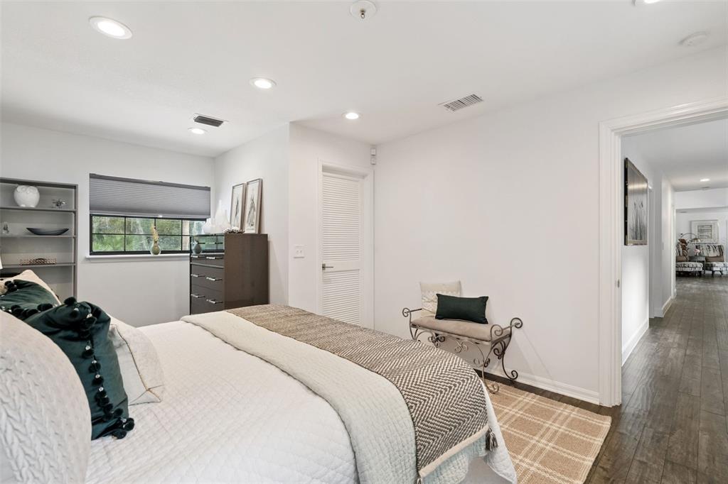 298 Lake Markham Road Sanford, FL 32771 - Photo 18 of 50 a bedroom with a bed and a view of kitchen