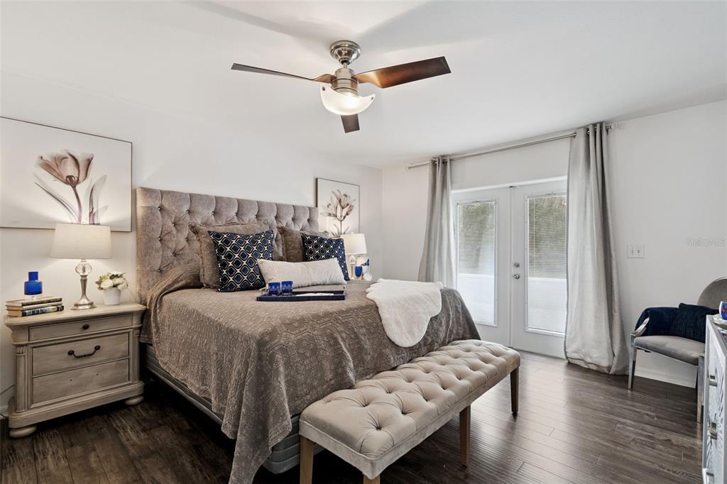 298 Lake Markham Road Sanford, FL 32771 - Photo 19 of 50 a bedroom with bed and wooden floor