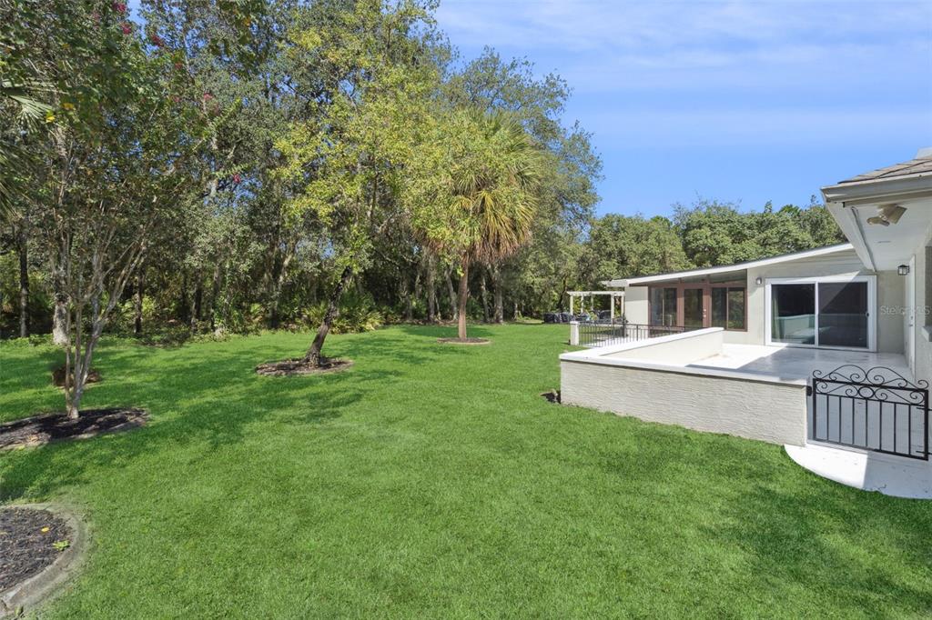 298 Lake Markham Road Sanford, FL 32771 - Photo 28 of 50 a house view with a sitting space and garden