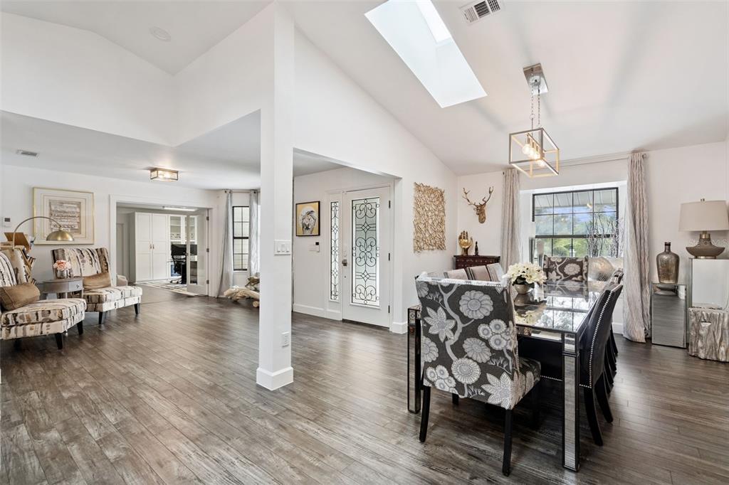 298 Lake Markham Road Sanford, FL 32771 - Photo 3 of 50 a view of a dining room with furniture and wooden floor