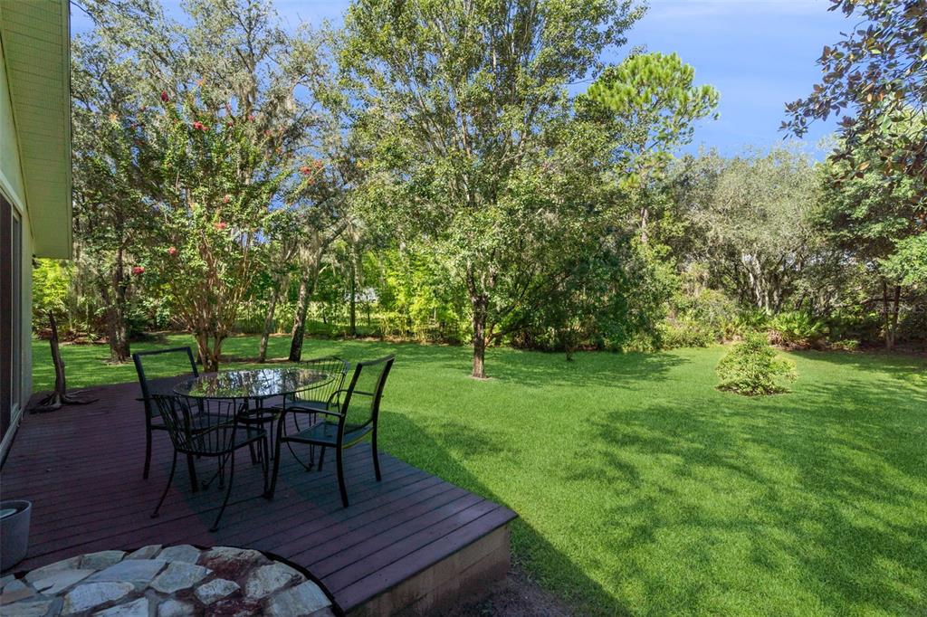 298 Lake Markham Road Sanford, FL 32771 - Photo 47 of 50 a view of a backyard with table and chairs