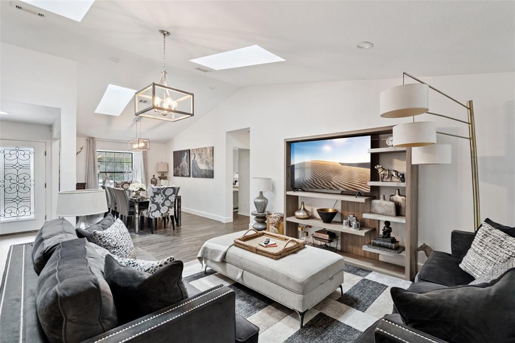 298 Lake Markham Road Sanford, FL 32771 - Photo 6 of 50 a living room with furniture and a flat screen tv