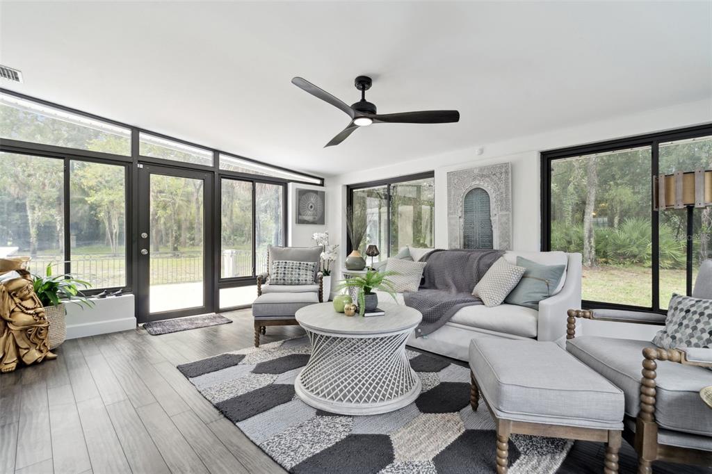 298 Lake Markham Road Sanford, FL 32771 - Photo 8 of 50 a living room with furniture and a potted plant