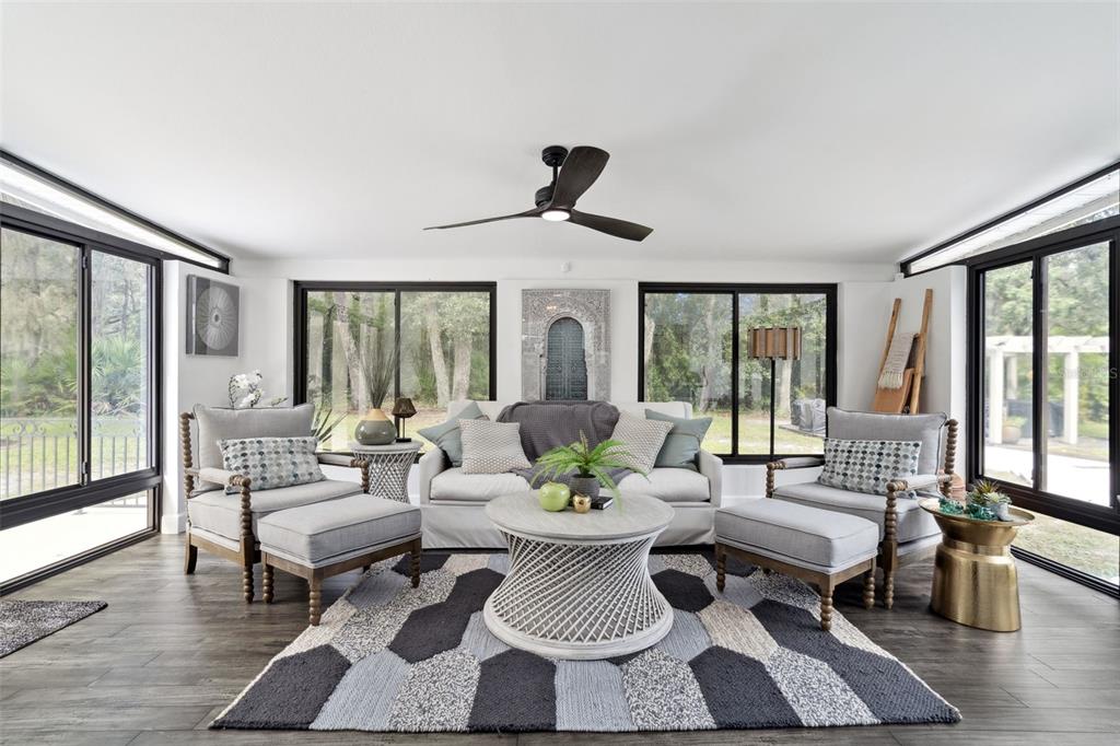 298 Lake Markham Road Sanford, FL 32771 - Photo 9 of 50 a living room with furniture and a large window
