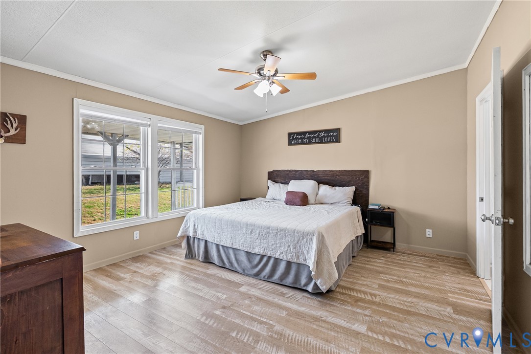 299 Arvin Store Road Keysville, VA 23947 - Photo 11 of 45 a bedroom with a large bed and a window