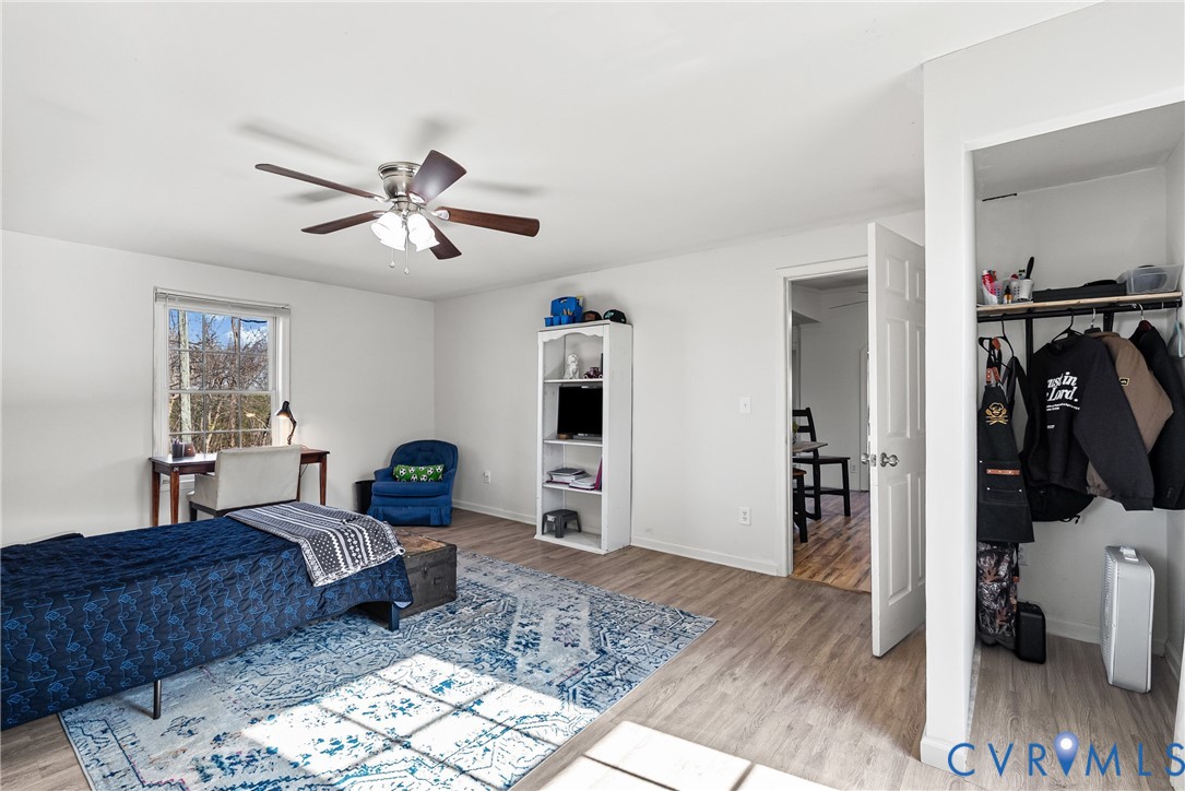 299 Arvin Store Road Keysville, VA 23947 - Photo 17 of 45 a living room with furniture and a wooden floor