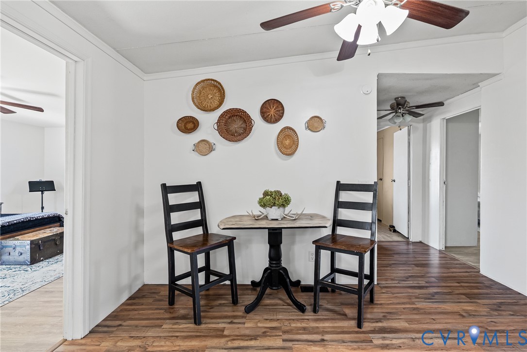 299 Arvin Store Road Keysville, VA 23947 - Photo 19 of 45 a view of a dining room with furniture and wooden floor