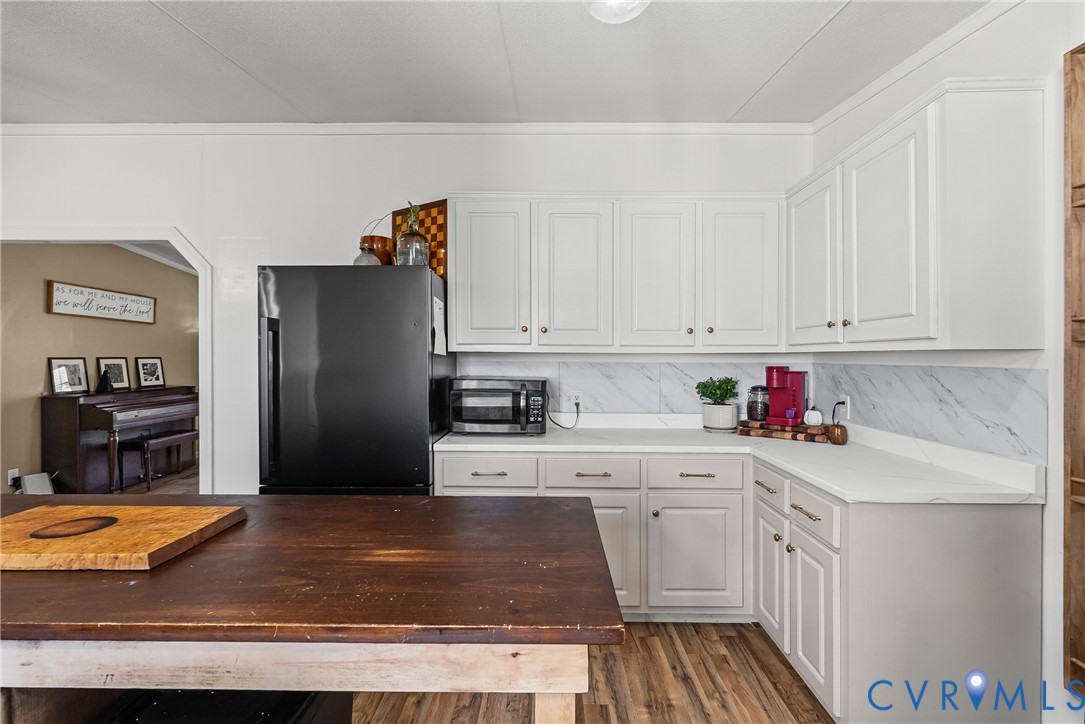 299 Arvin Store Road Keysville, VA 23947 - Photo 20 of 45 a kitchen with granite countertop a refrigerator stove and sink