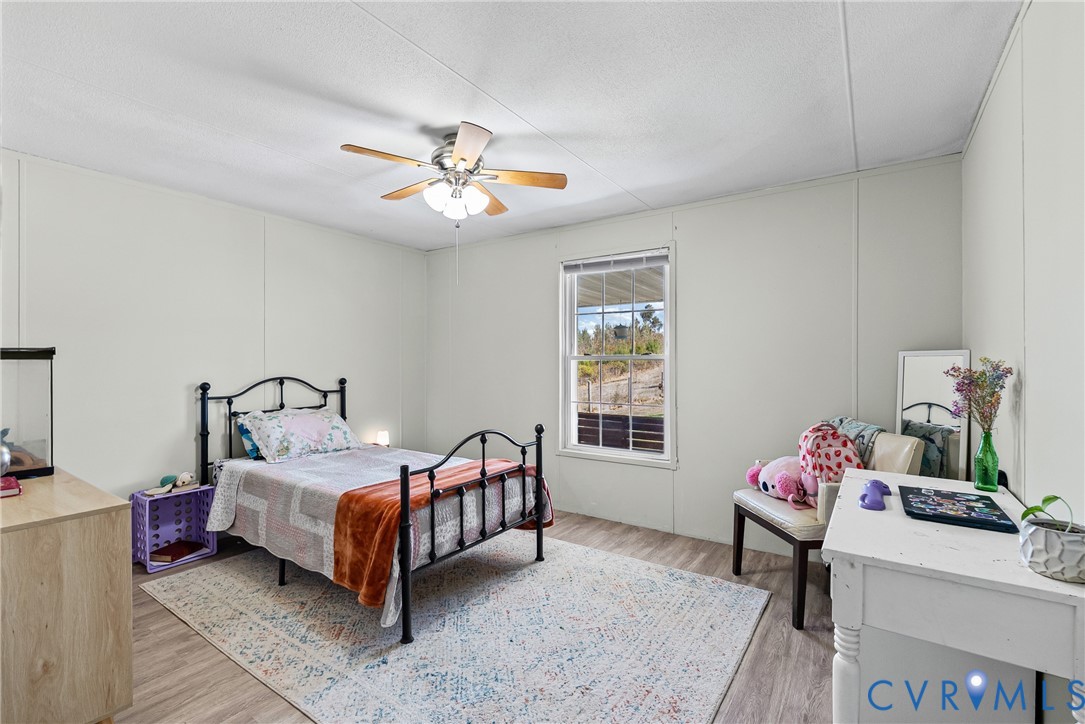299 Arvin Store Road Keysville, VA 23947 - Photo 23 of 45 a bedroom with a bed dresser and window