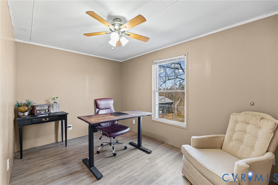 299 Arvin Store Road Keysville, VA 23947 - Photo 25 of 45 a view of a workspace with furniture and a window