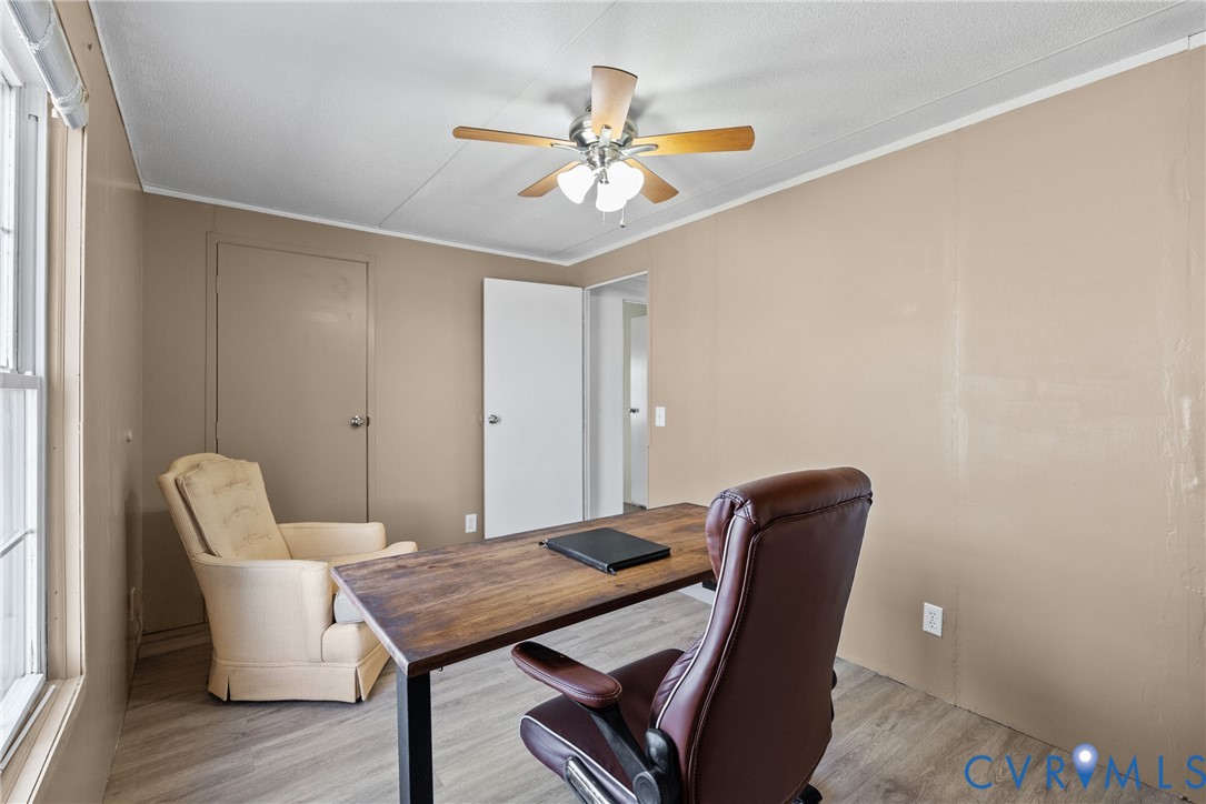 299 Arvin Store Road Keysville, VA 23947 - Photo 26 of 45 a view of a dining room with furniture and wooden floor