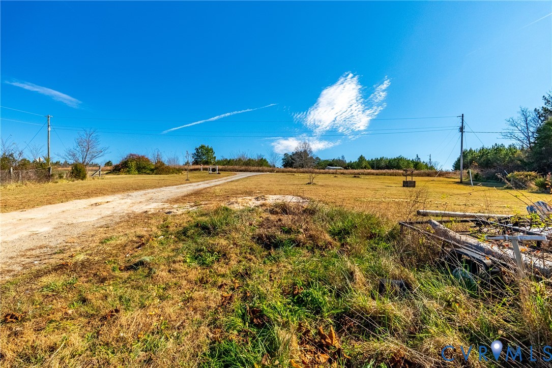 299 Arvin Store Road Keysville, VA 23947 - Photo 30 of 45 a view of a swimming pool with an outdoor space and seating area