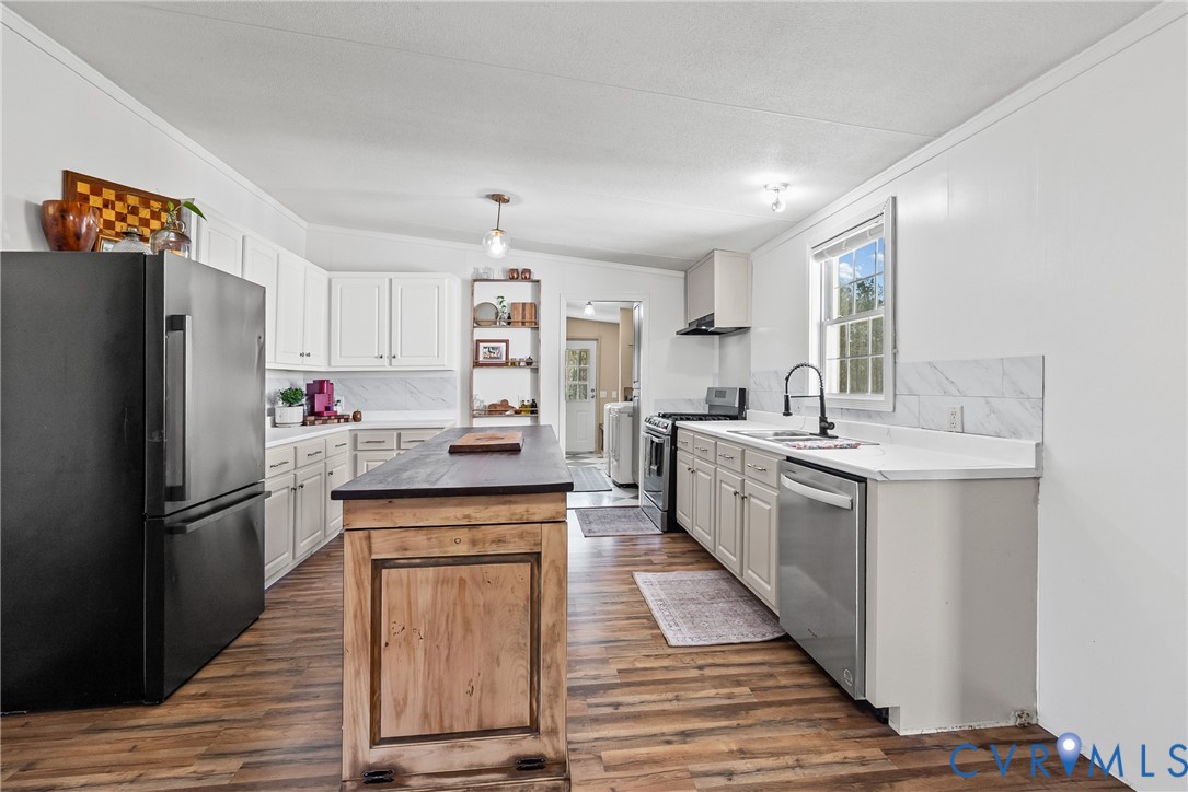 299 Arvin Store Road Keysville, VA 23947 - Photo 3 of 45 a kitchen with stainless steel appliances granite countertop a refrigerator and a sink