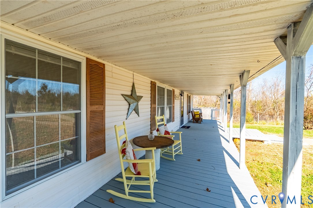 299 Arvin Store Road Keysville, VA 23947 - Photo 7 of 45 a view of a porch with furniture and wooden floor