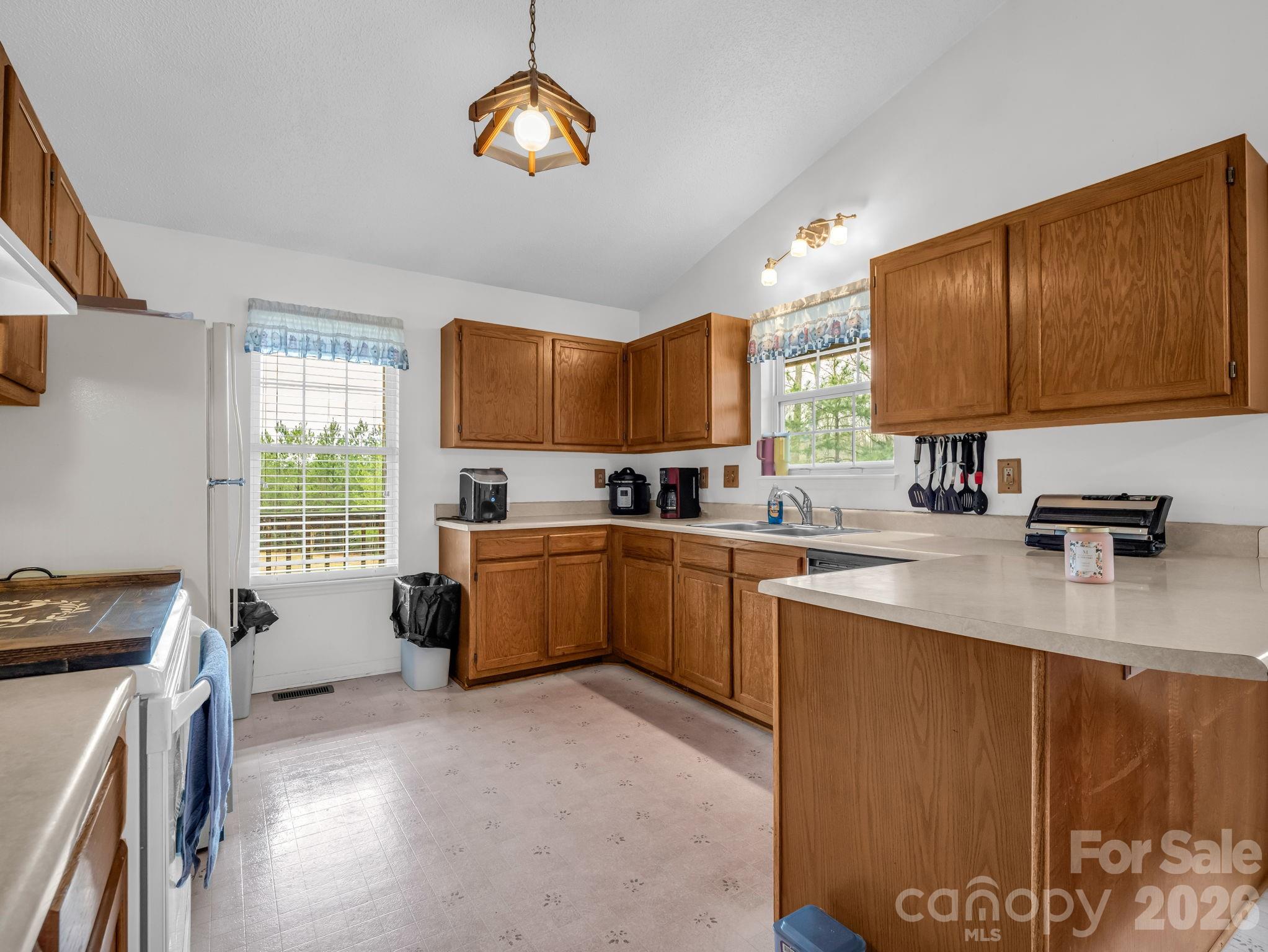 308 Frog Hollow Road Rutherfordton, NC 28139 - Photo 11 of 26 a kitchen with a sink appliances cabinets and a window