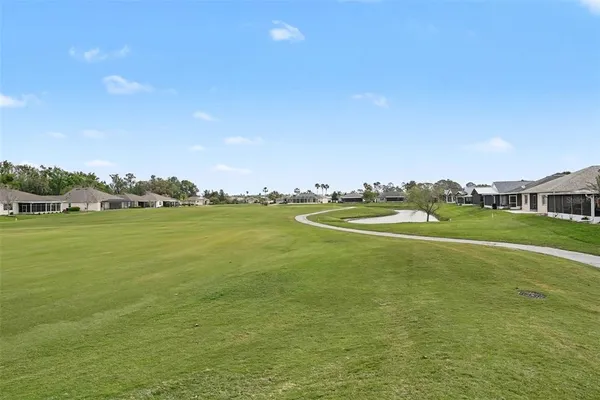 a view of an house with a big yard