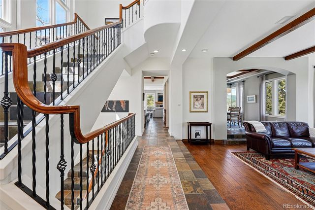 a living room with furniture fireplace and a wooden floor