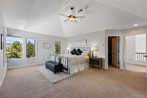 a bed room with furniture and a chandelier