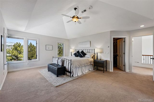 a bed room with furniture and a chandelier