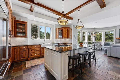 a open kitchen with stainless steel appliances granite countertop a stove and cabinets
