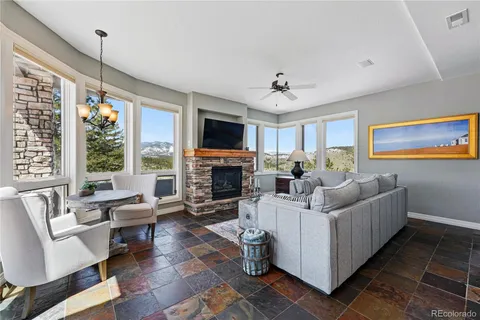 a living room with furniture fireplace and a flat screen tv