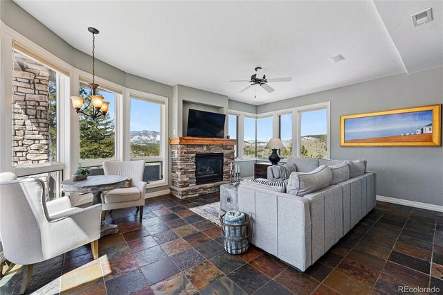 a living room with furniture fireplace and a flat screen tv
