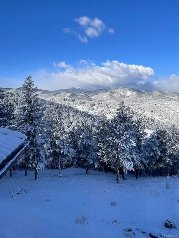 a view of a houses with a table and chairs