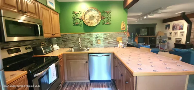 a kitchen with a stove and a sink