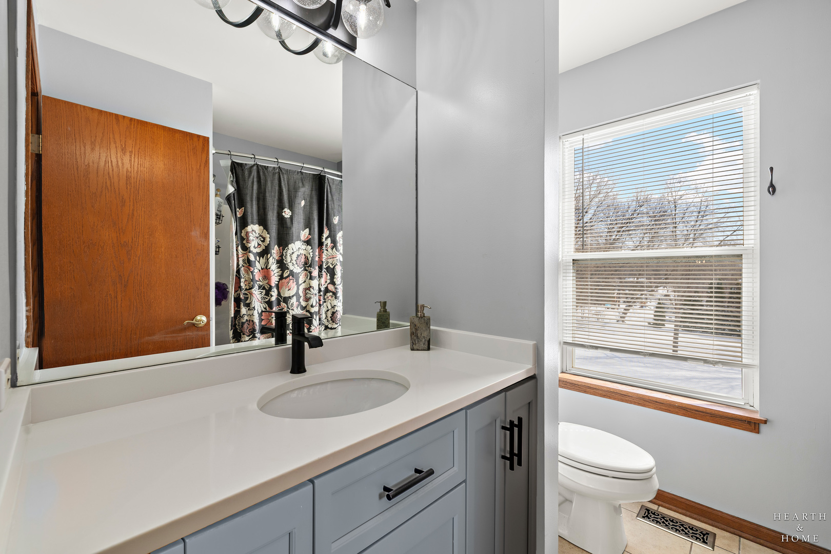 10514 Ridge Lane Marengo, IL 60152 - Photo 34 of 51 a bathroom with a sink a toilet and a large mirror