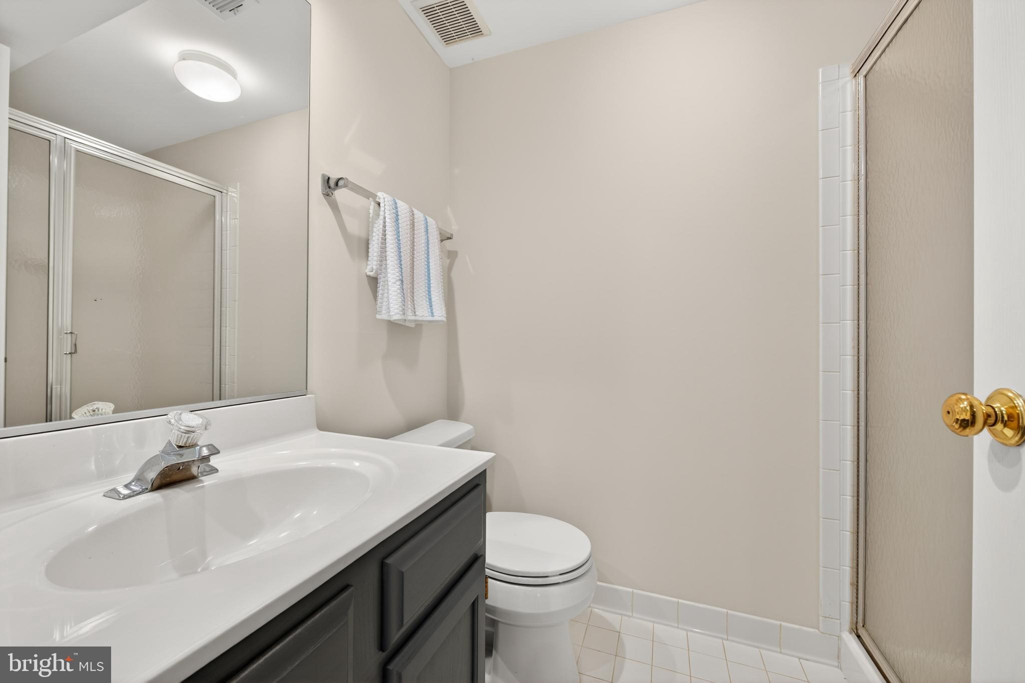 1409 Park Garden Lane Reston, VA 20194 - Photo 27 of 41 a bathroom with a sink toilet and vanity