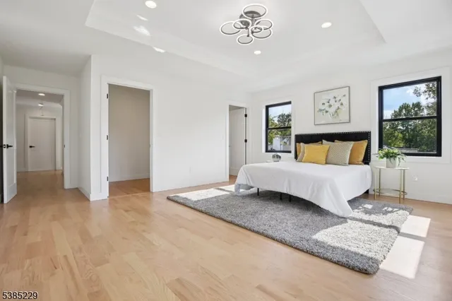 a bedroom with a large bed and a couch