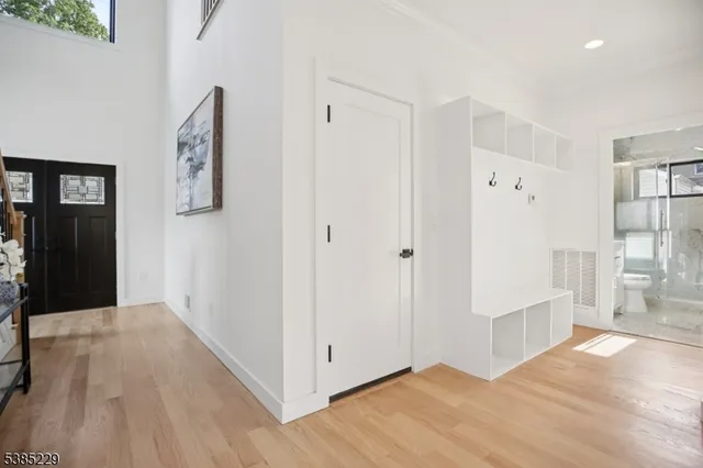 a view of entryway with wooden floor