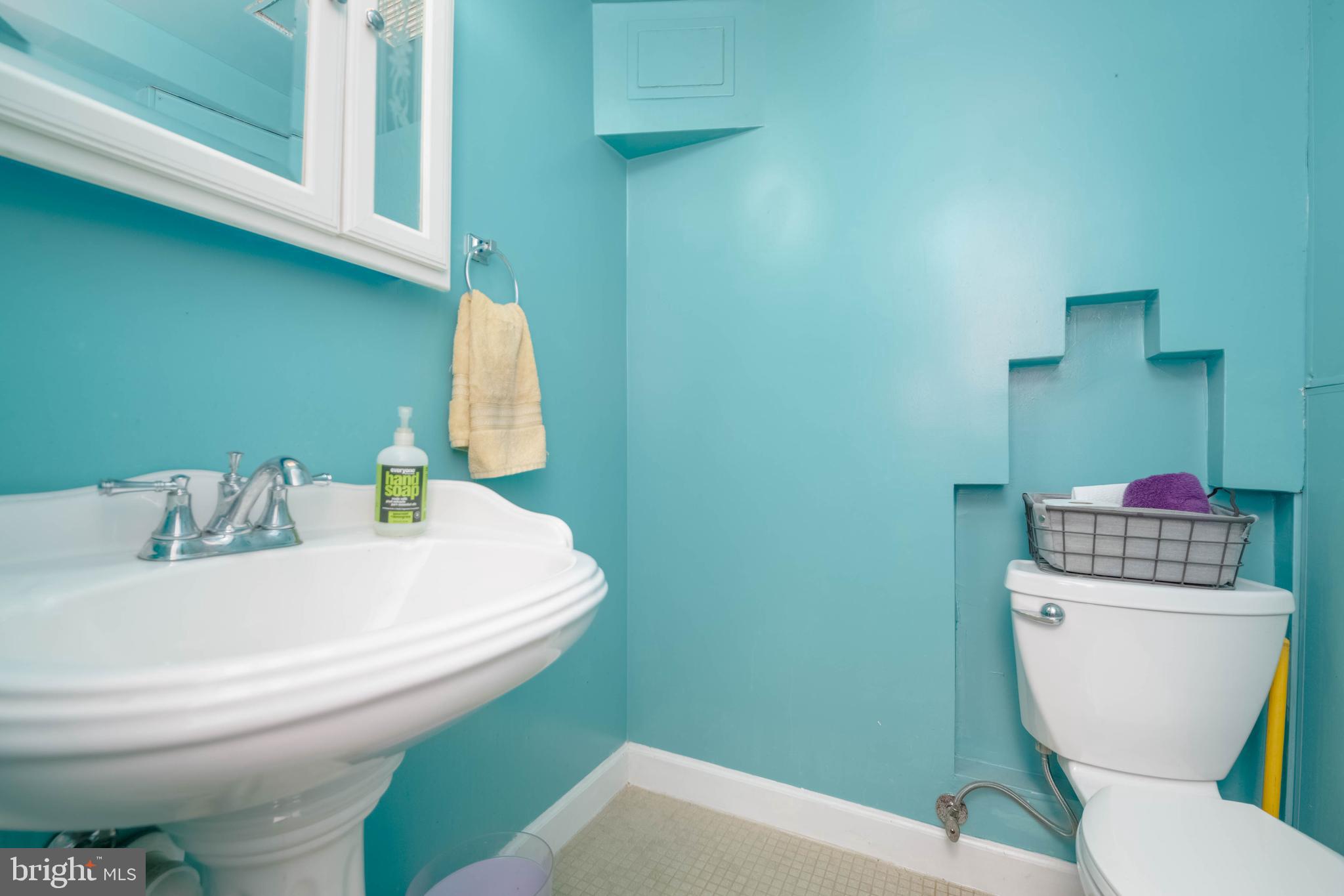 2302 Searles Road Dundalk, MD 21222 - Photo 27 of 35 a bathroom with a toilet and a sink