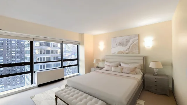 a bedroom with a bed and a flat tv screen