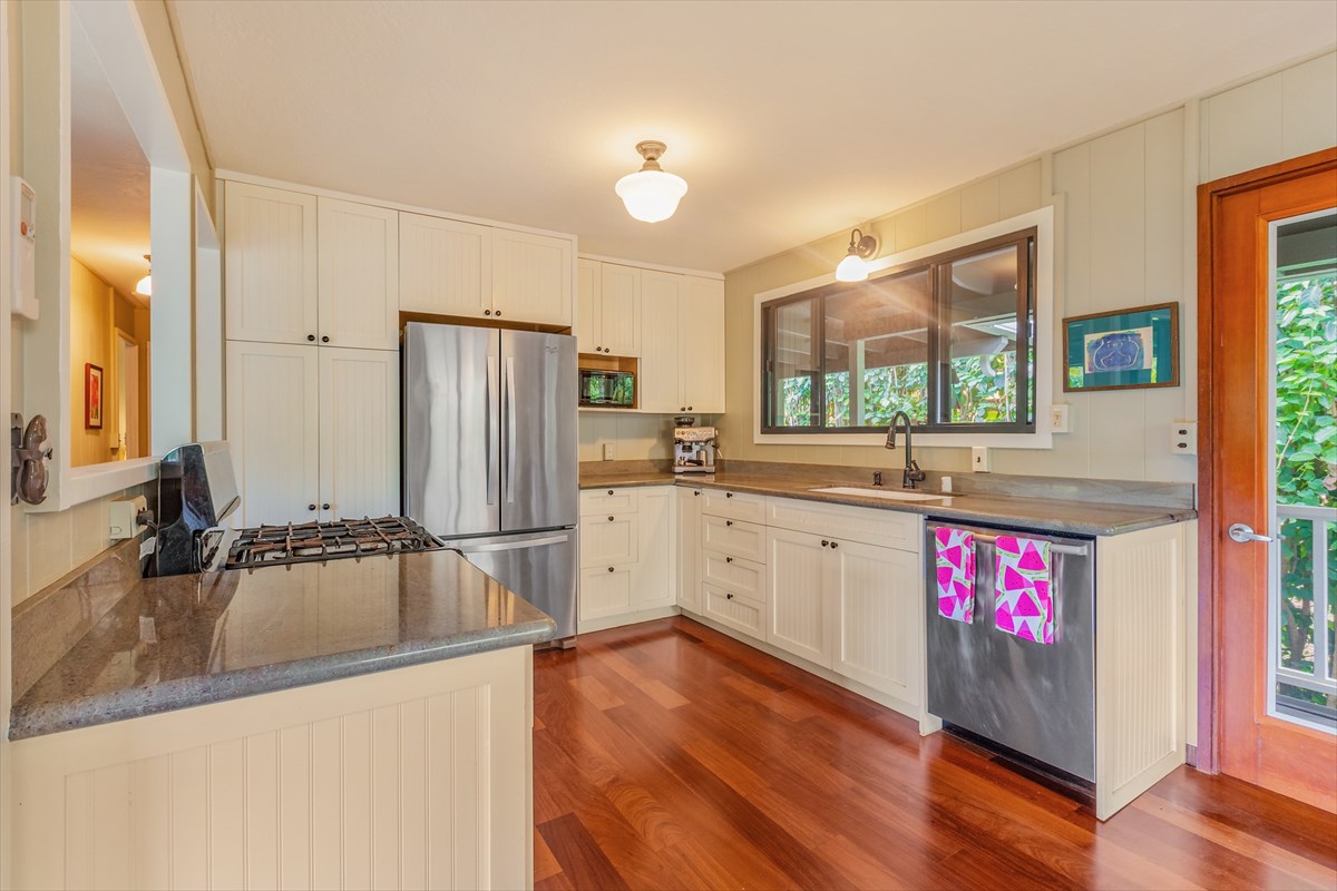 4826 Pelehu Road Kapaa, HI 96746 - Photo 4 of 25 a kitchen with granite countertop a refrigerator and a sink