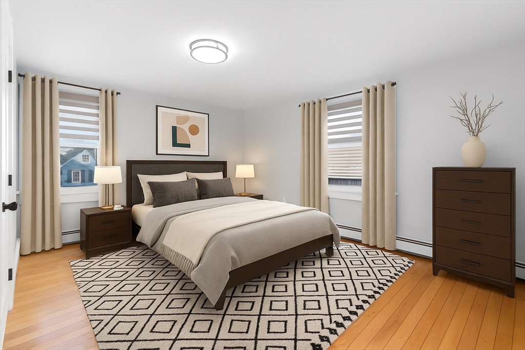 129 Friend Street, Unit 2 Amesbury, MA 01913 - Photo 11 of 27 a bedroom with a bed and a dresser