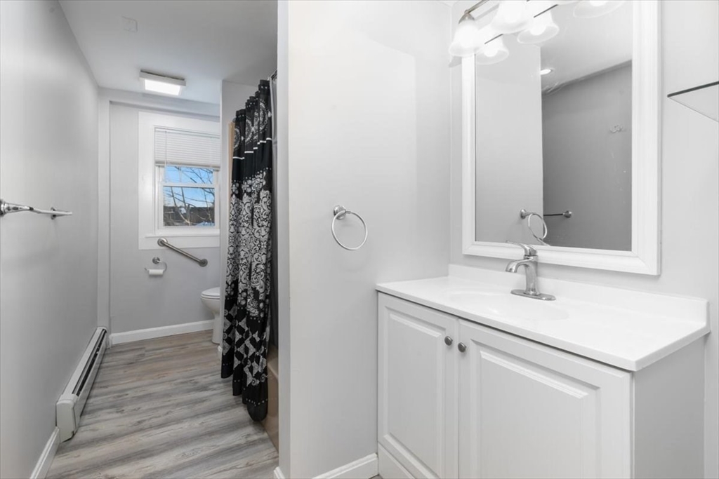129 Friend Street, Unit 2 Amesbury, MA 01913 - Photo 13 of 27 a bathroom with a sink and a mirror