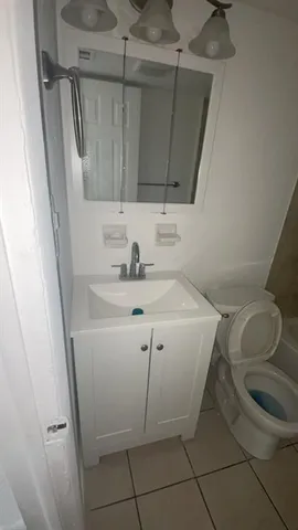 a view of an empty room and a window