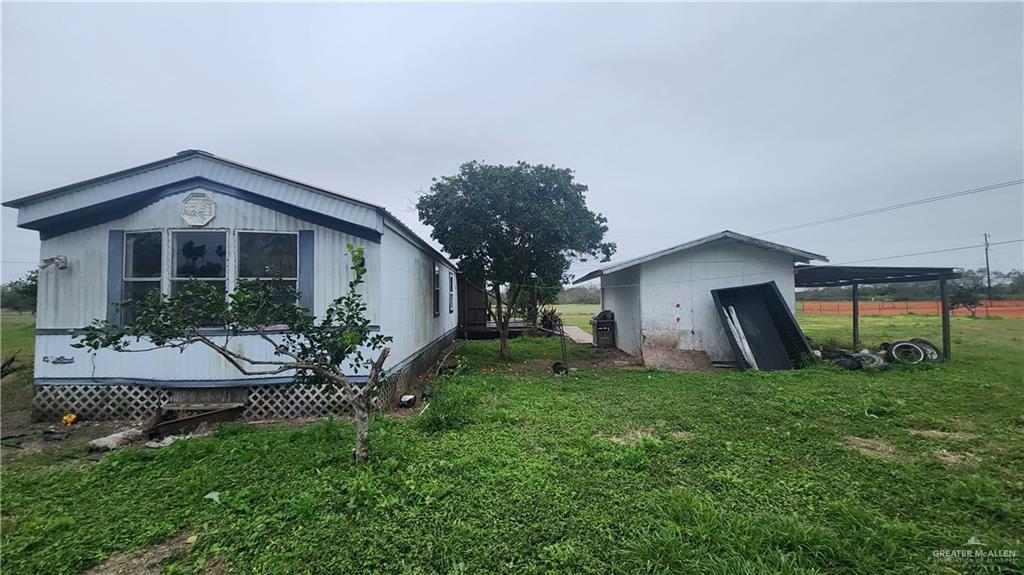 32656 San Carlos Road, Unit 2 Los Fresnos, TX 78566 - Photo 1 of 15 a view of an house with backyard space and garden