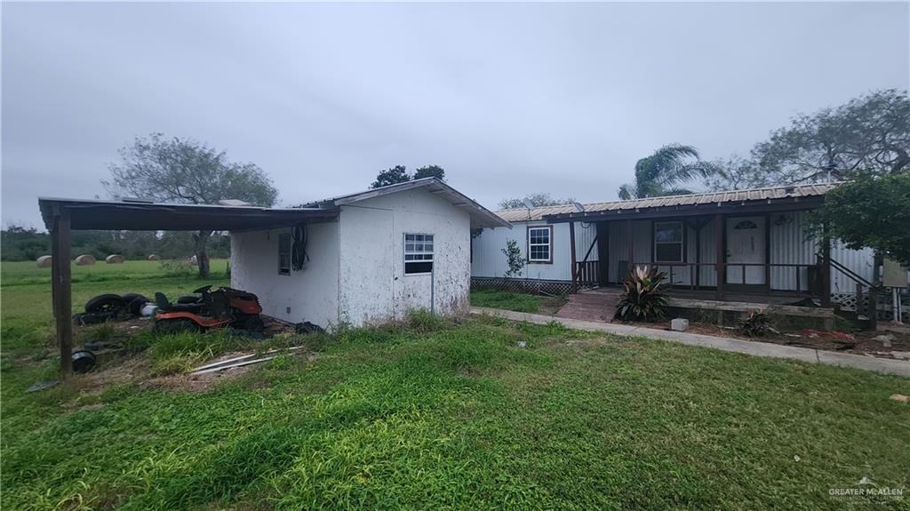 32656 San Carlos Road, Unit 2 Los Fresnos, TX 78566 - Photo 14 of 15 a view of a house with backyard and porch