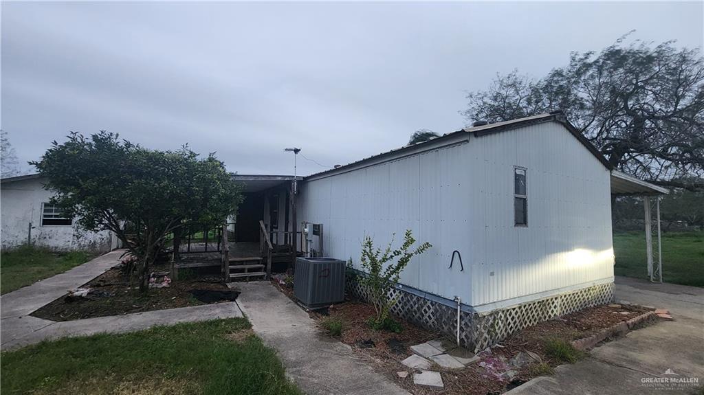 32656 San Carlos Road, Unit 2 Los Fresnos, TX 78566 - Photo 15 of 15 a front view of a house with garden