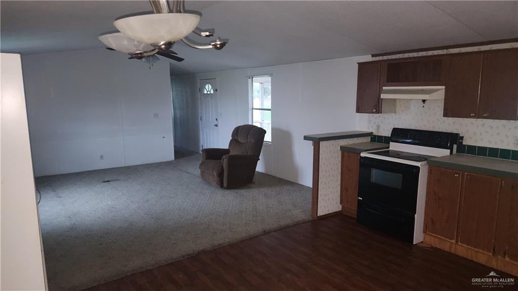 32656 San Carlos Road, Unit 2 Los Fresnos, TX 78566 - Photo 9 of 15 a kitchen with a refrigerator and a stove