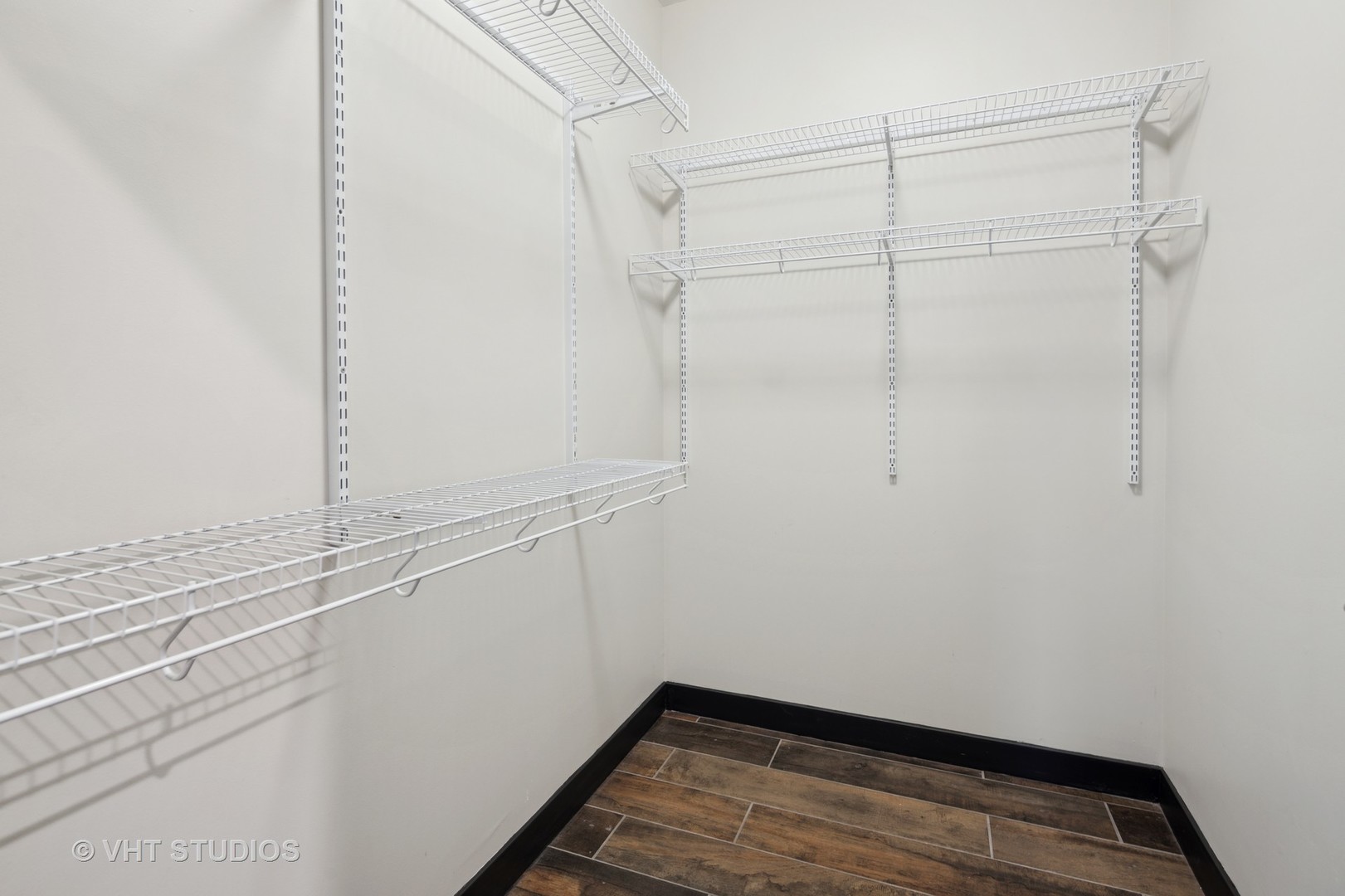 171 North Aberdeen Street, Unit 806 Chicago, IL 60607 - Photo 14 of 18 a view of a room with racks on the wall