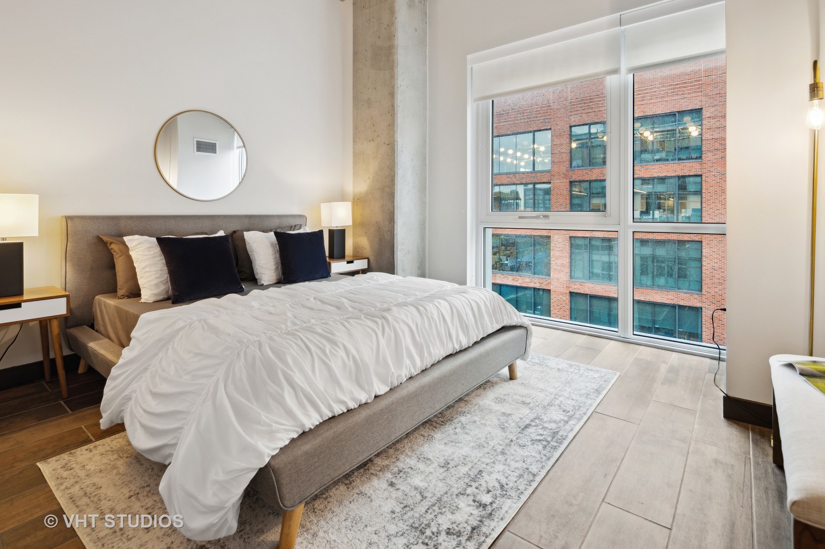 171 North Aberdeen Street, Unit 806 Chicago, IL 60607 - Photo 16 of 18 a bedroom with a large bed and a window