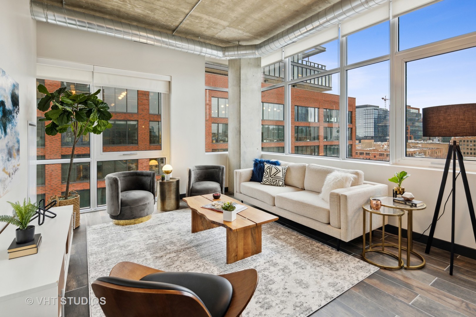 171 North Aberdeen Street, Unit 806 Chicago, IL 60607 - Photo 2 of 18 a living room with furniture potted plant and a large window