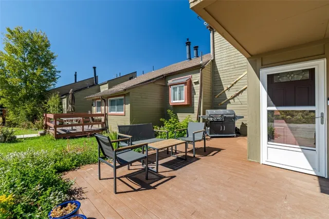 a view of a house with backyard sitting area and garden